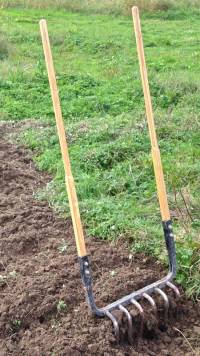 A broadfork (grelinette) from Red Pig Garden Tools for loosening compacted soil. The name Red Pig Garden Tools is a registered trademark of R.Z and R.K. Denman, Boring, Oregon 97009