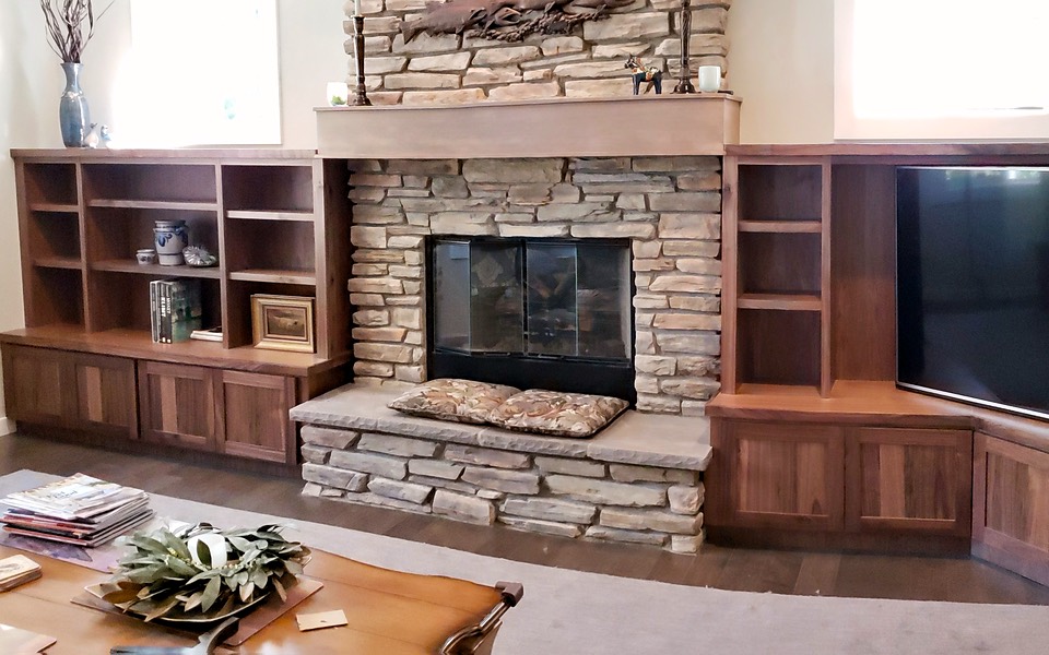 Custom shelving and TV around fireplace
